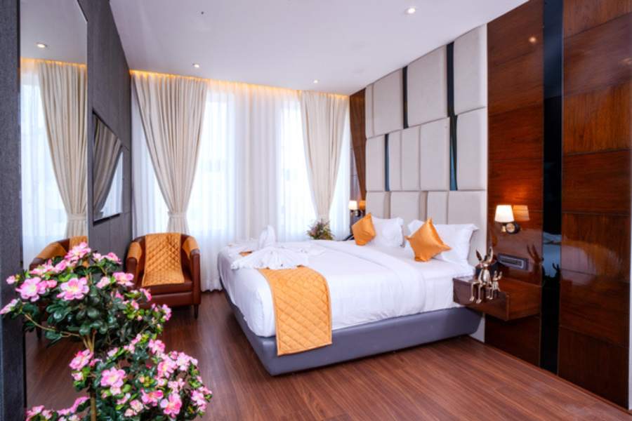 Family suite room at Hotel Paramos Meeds Madiwala with separate living area